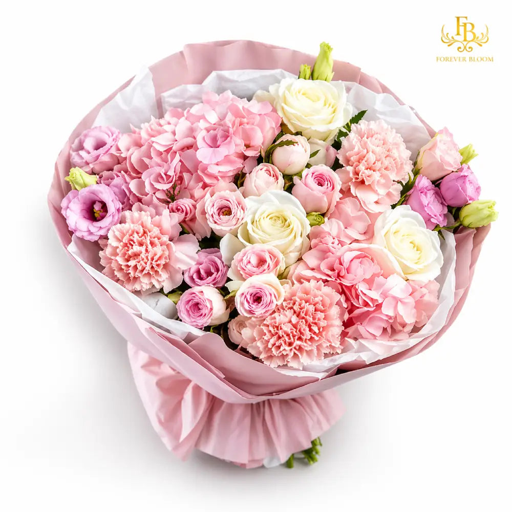 Bouquet of pink and white flowers wrapped in pink paper on a white background
