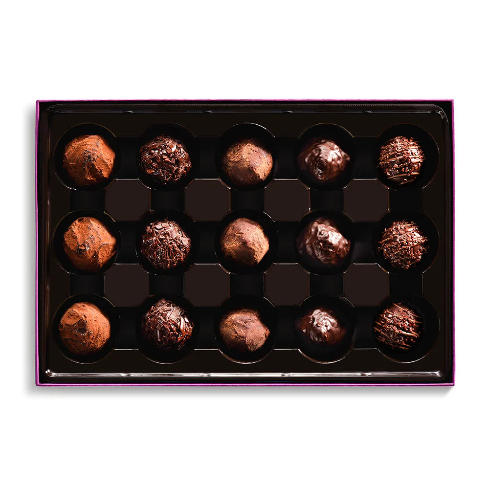Box of chocolate truffles on a white background