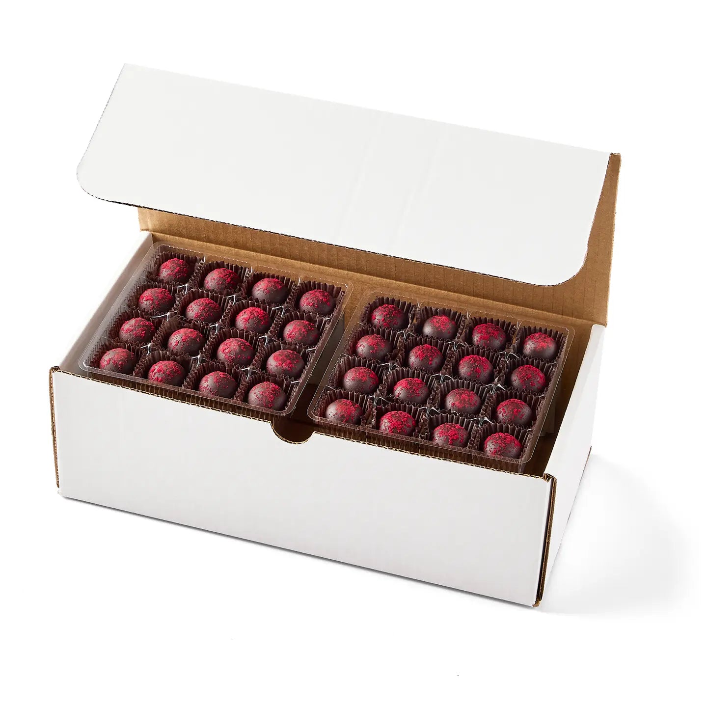 Open box of chocolates with a white background