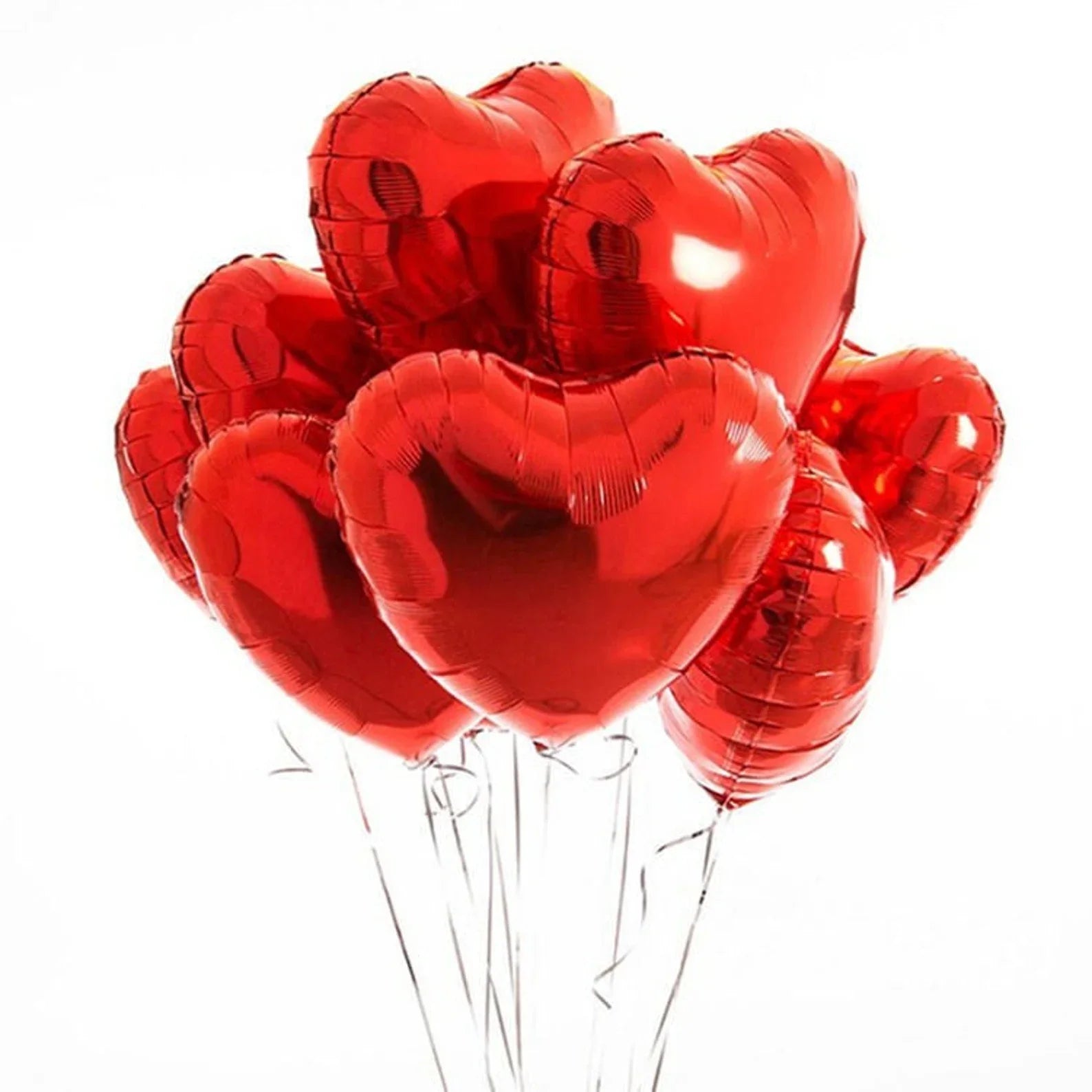 Bouquet of red heart-shaped balloons on a white background