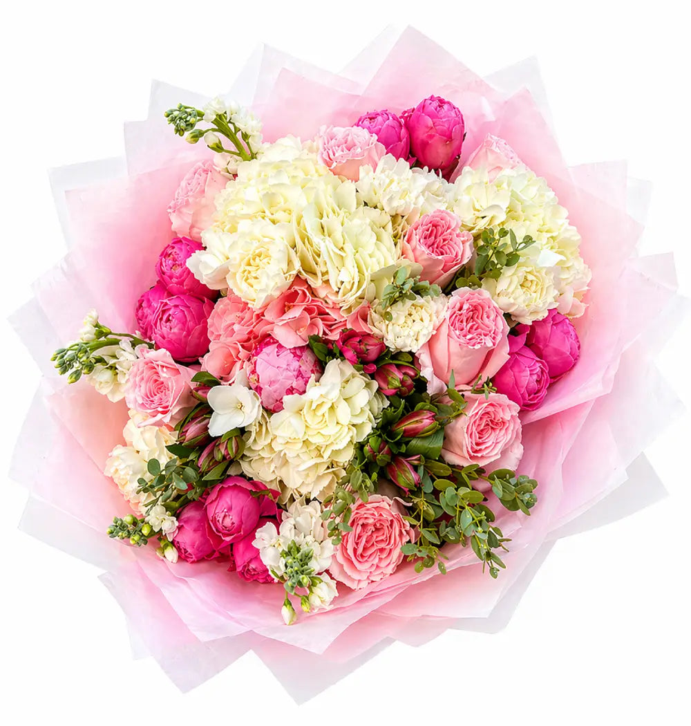 Bouquet of pink and white flowers with greenery on a white background