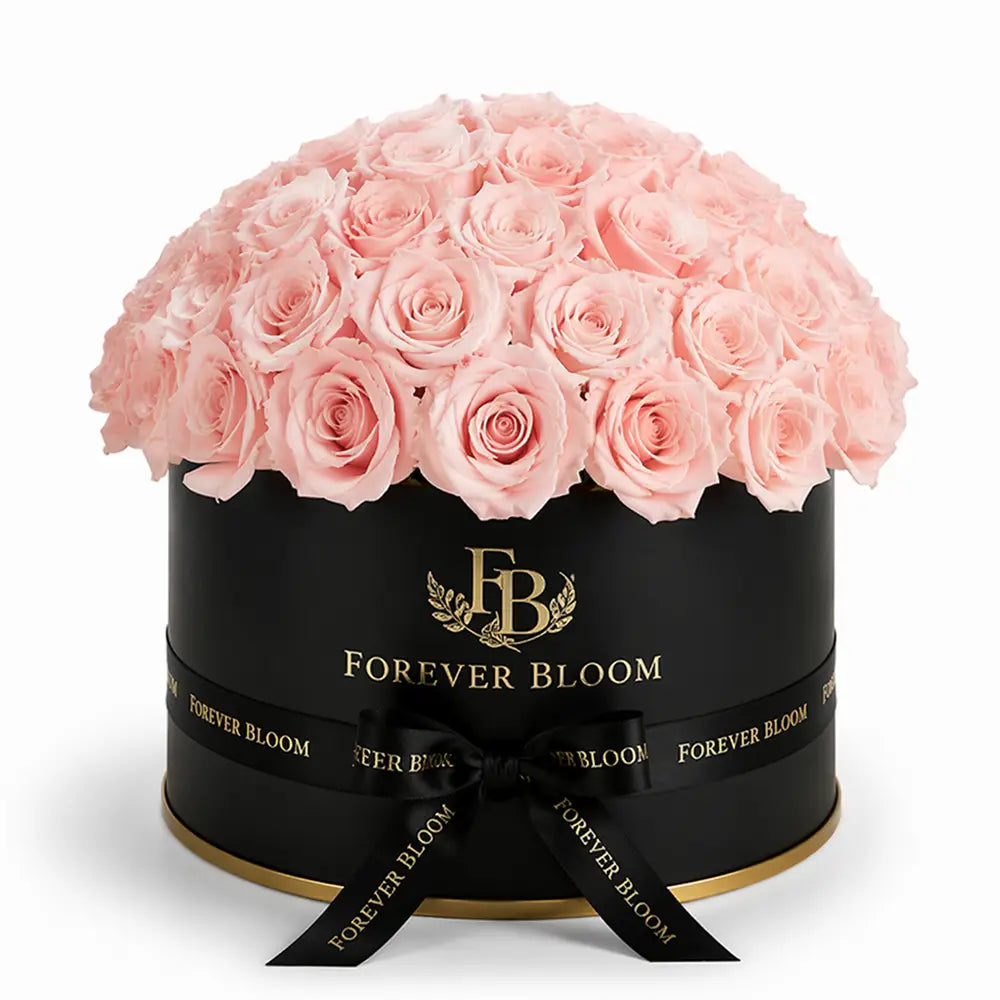 Black box with pink roses and 'Forever Bloom' branding on a white background