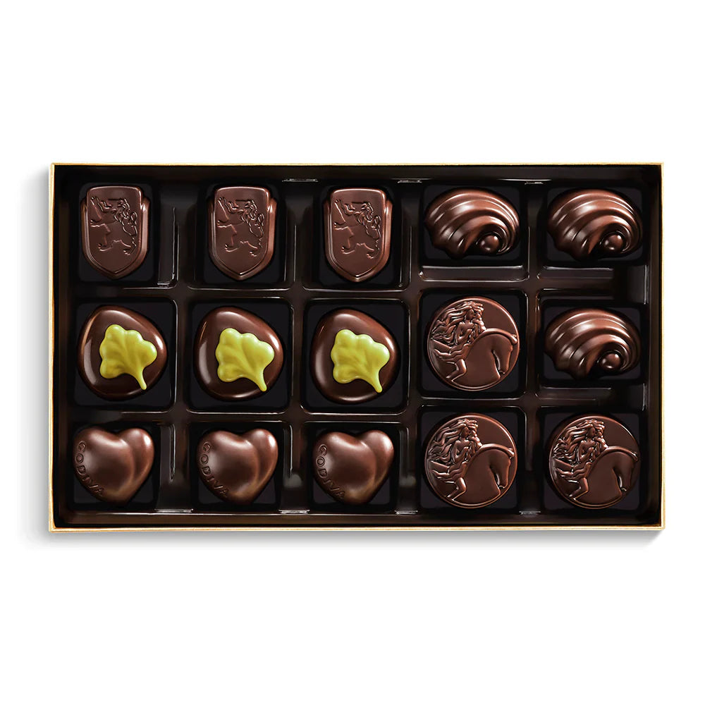 Assorted chocolate candies in a box on a white background