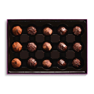 Box of chocolate truffles on a white background
