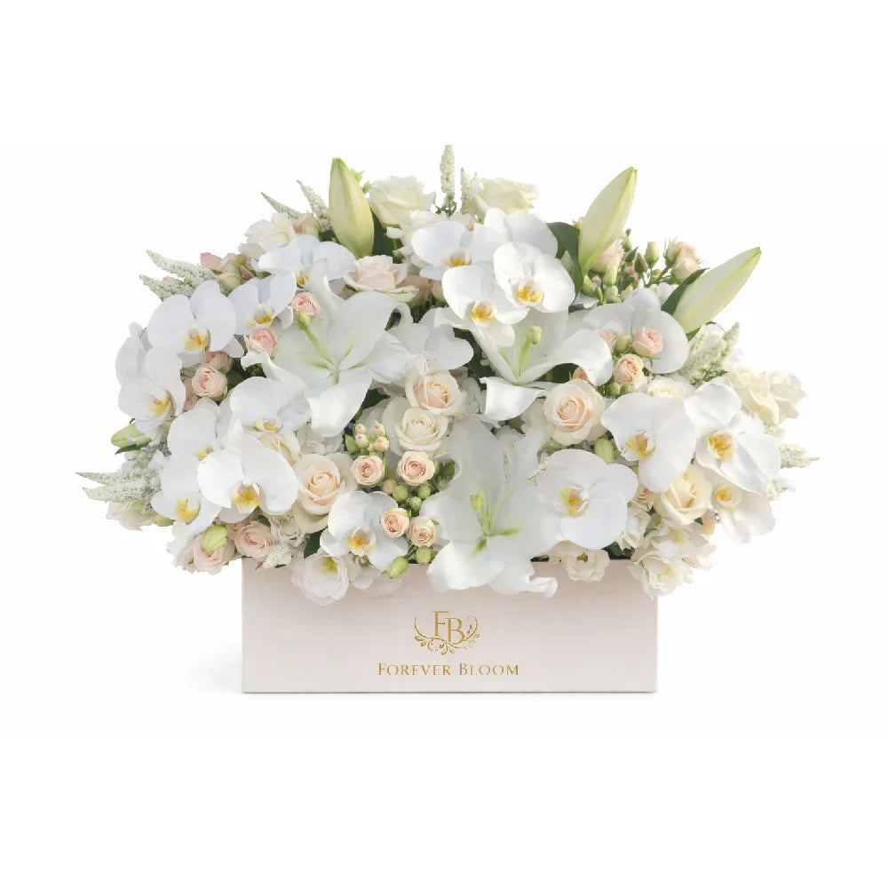 Floral arrangement with white and light pink flowers in a box, branded 'Forever Bloom'.