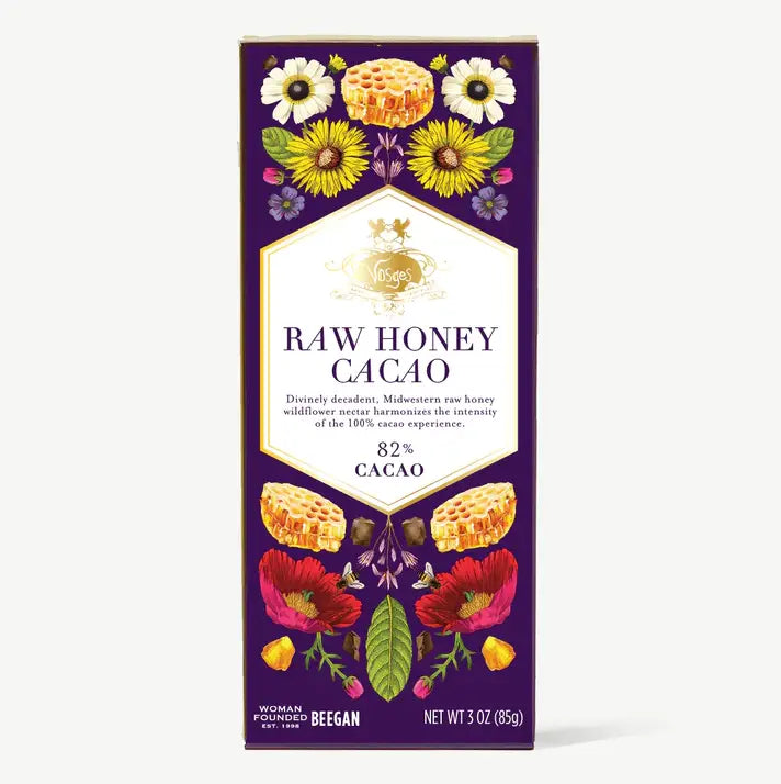 Raw honey cacao product packaging with floral and honeycomb design on a purple background